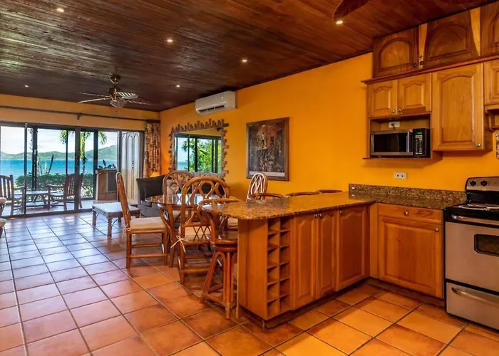 Beachfront With Warm, Rustic Interiors & Direct Access To Holiday home